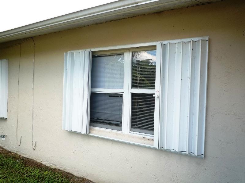 656 Northwest Riverside Drive Port St. Lucie, FL 34983 - Photo 4 of 35 Accordion Shutters