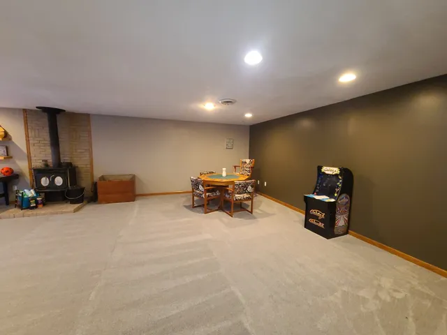 a bed room with furniture and a car