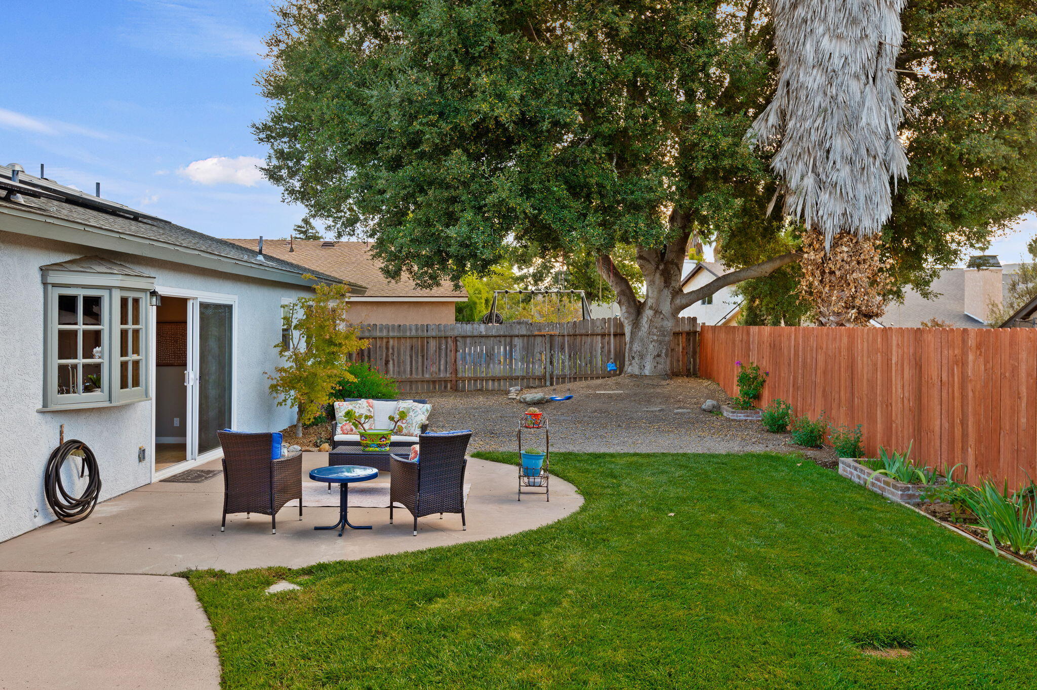 232 2nd Street Buellton, CA 93427 - Photo 19 of 29 a view of a chair and table in backyard of the house