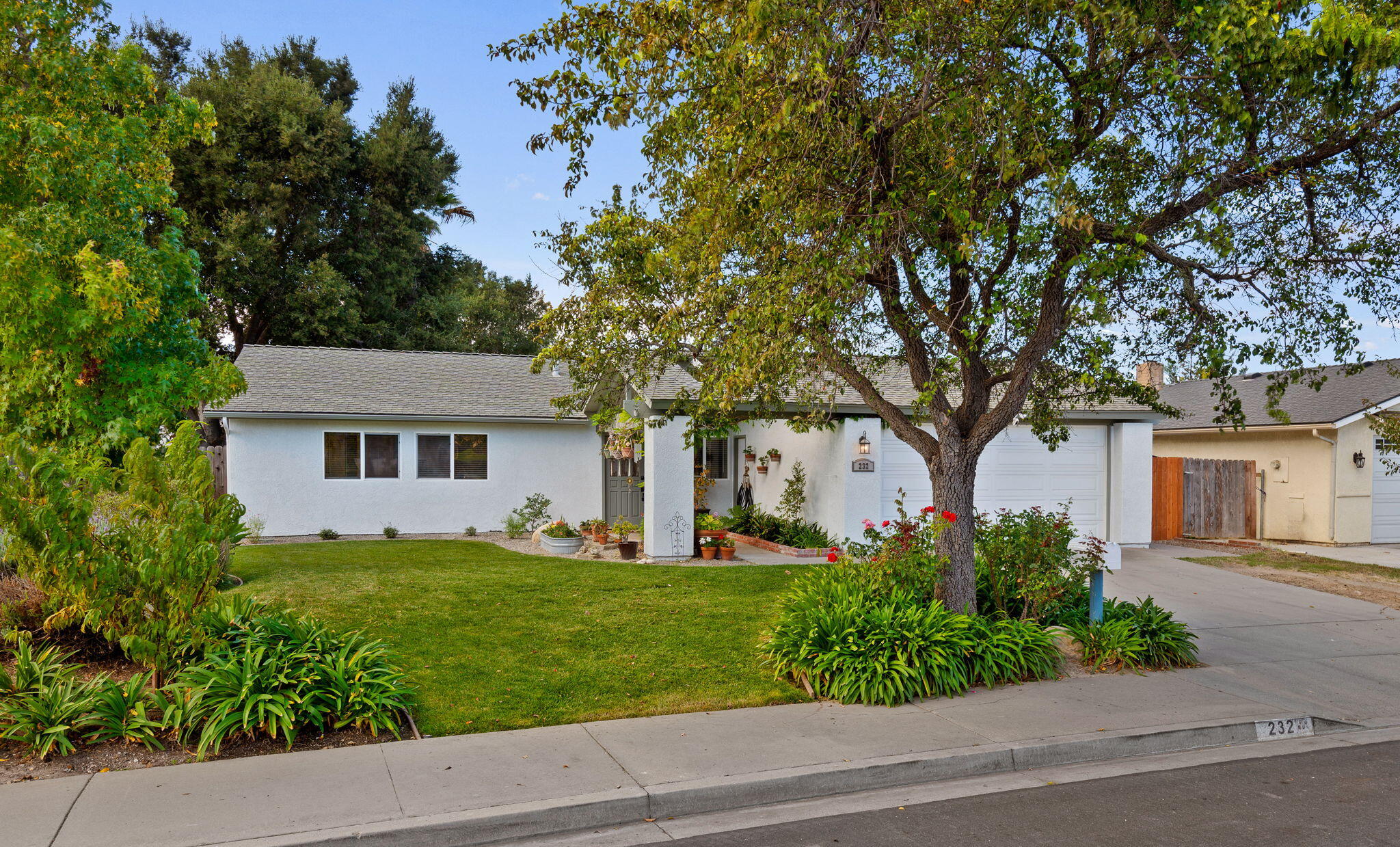 232 2nd Street Buellton, CA 93427 - Photo 2 of 29 a front view of a house with a yard and a garage