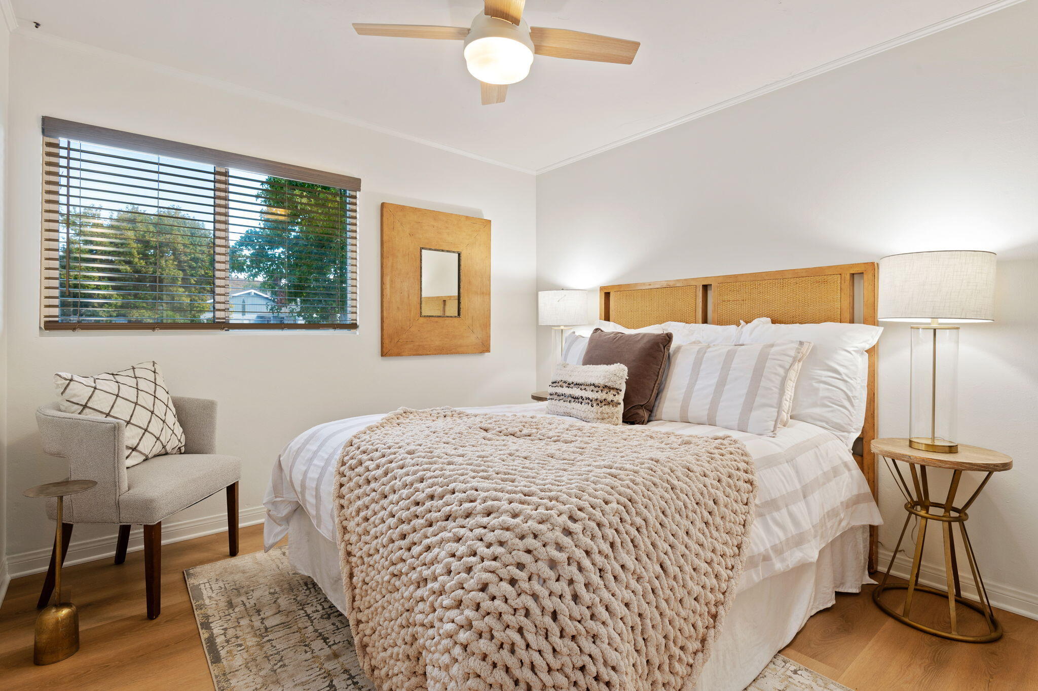 232 2nd Street Buellton, CA 93427 - Photo 25 of 29 a bedroom with a bed and a chandelier