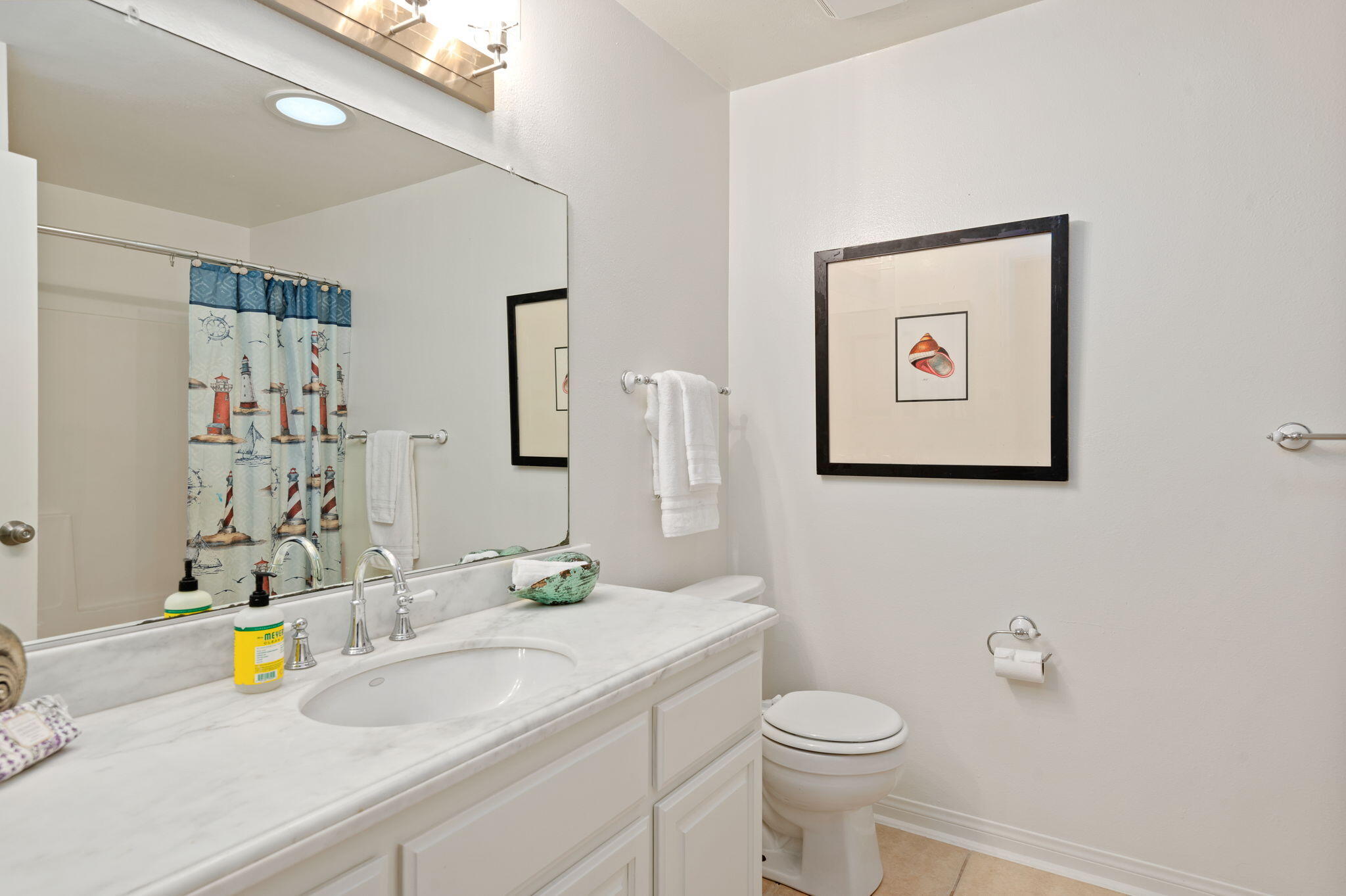 232 2nd Street Buellton, CA 93427 - Photo 26 of 29 a bathroom with a granite countertop sink and a mirror