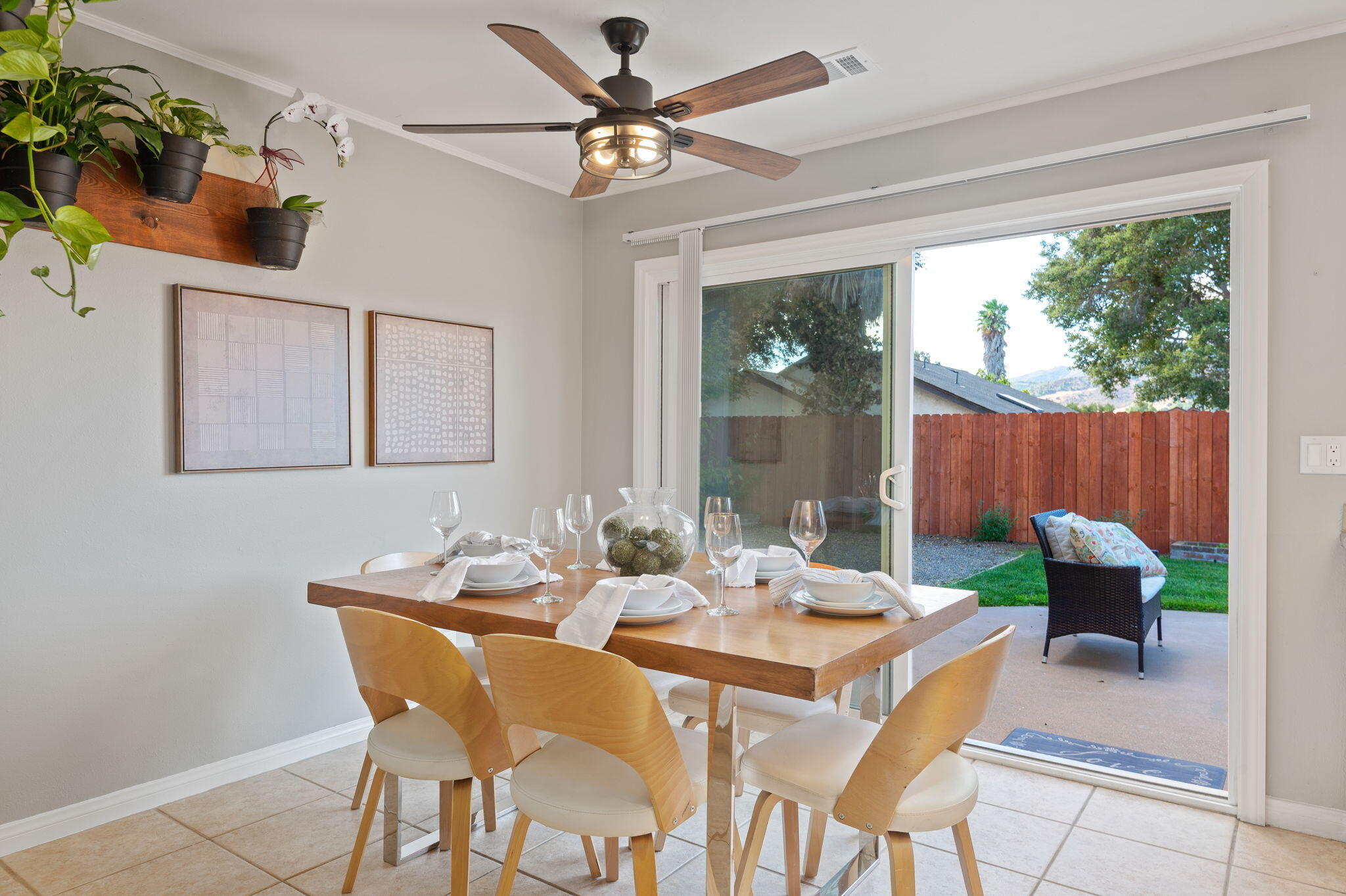 232 2nd Street Buellton, CA 93427 - Photo 9 of 29 a dining room with furniture a large window and a chandelier