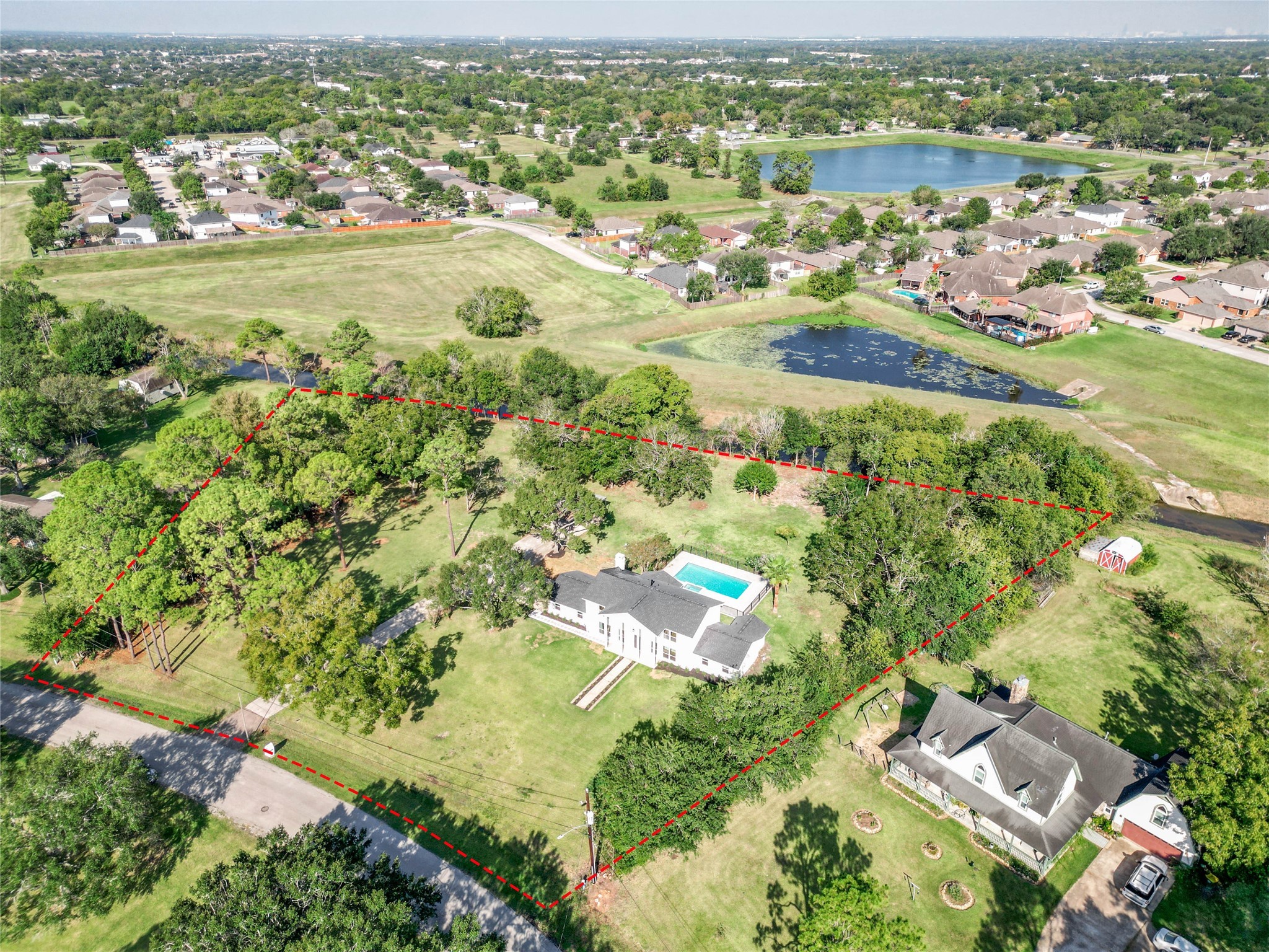 an aerial view of residential houses with outdoor space