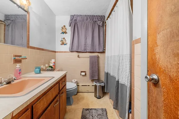 a view of a bathroom with a sink and a window