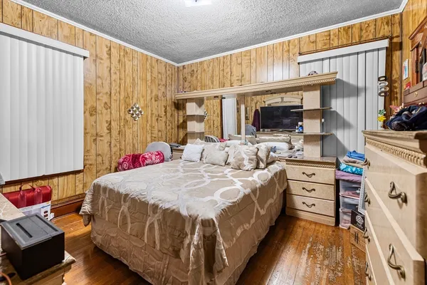 a bed room with a bed and a window