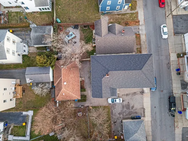 aerial view of a house with a yard