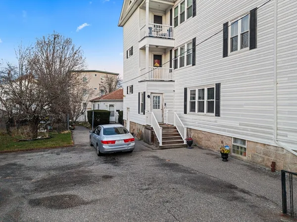 a car parked in front of a house