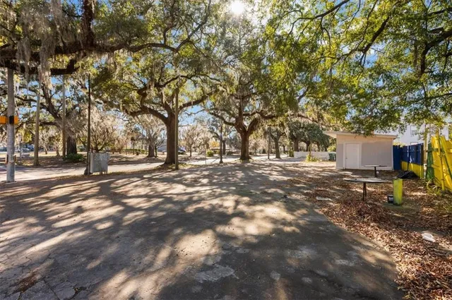 a view of outdoor space with deck and trees
