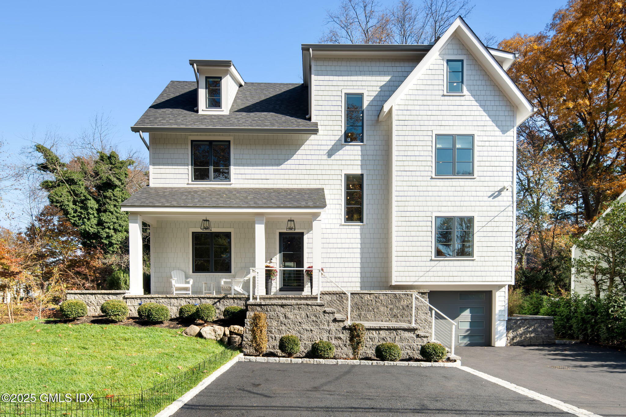 44 Amherst Road Old Greenwich, CT 06870 - Photo 1 of 39 a front view of the house with garage