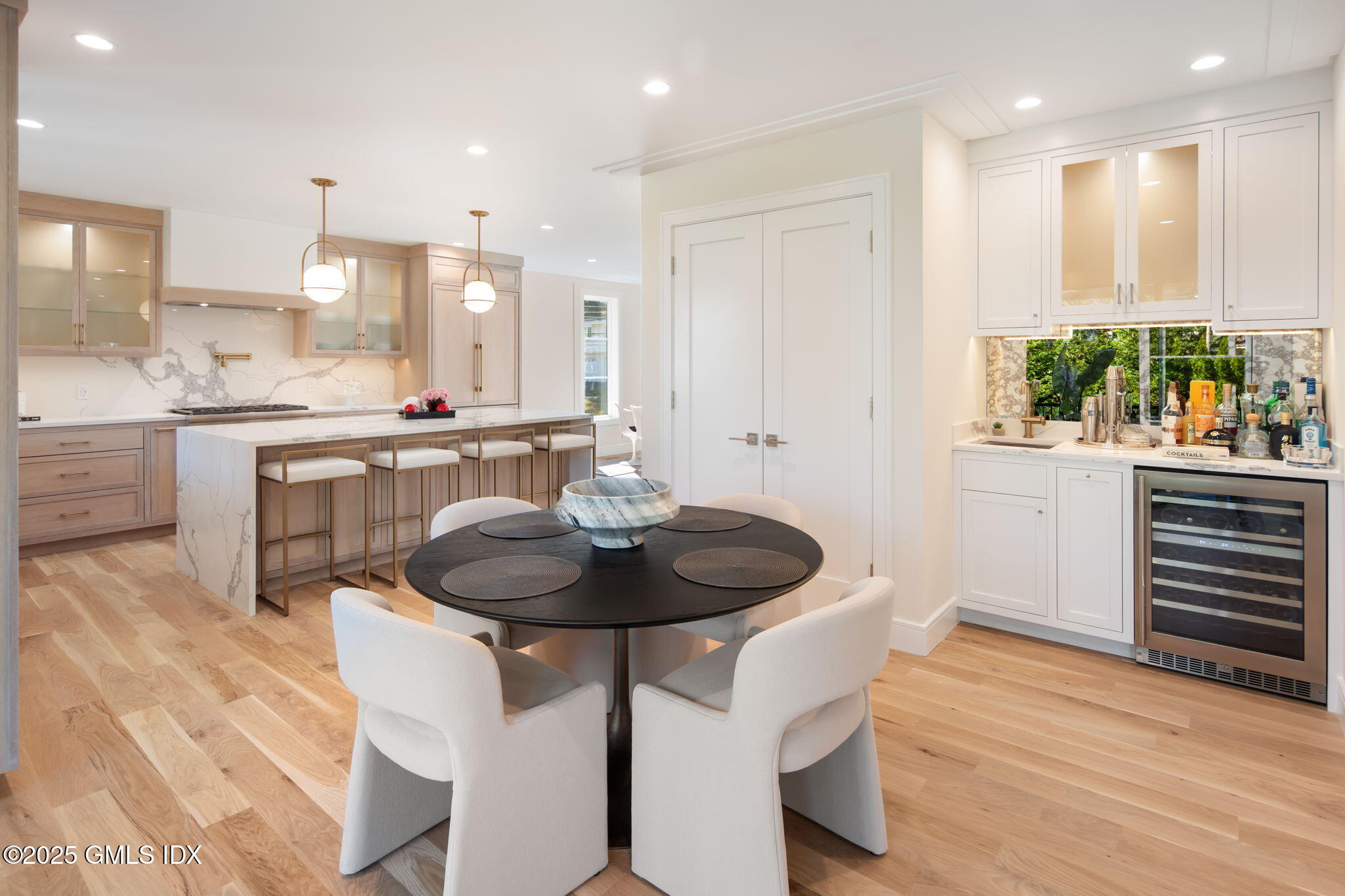 44 Amherst Road Old Greenwich, CT 06870 - Photo 11 of 39 a kitchen with a sink cabinets appliances and living room