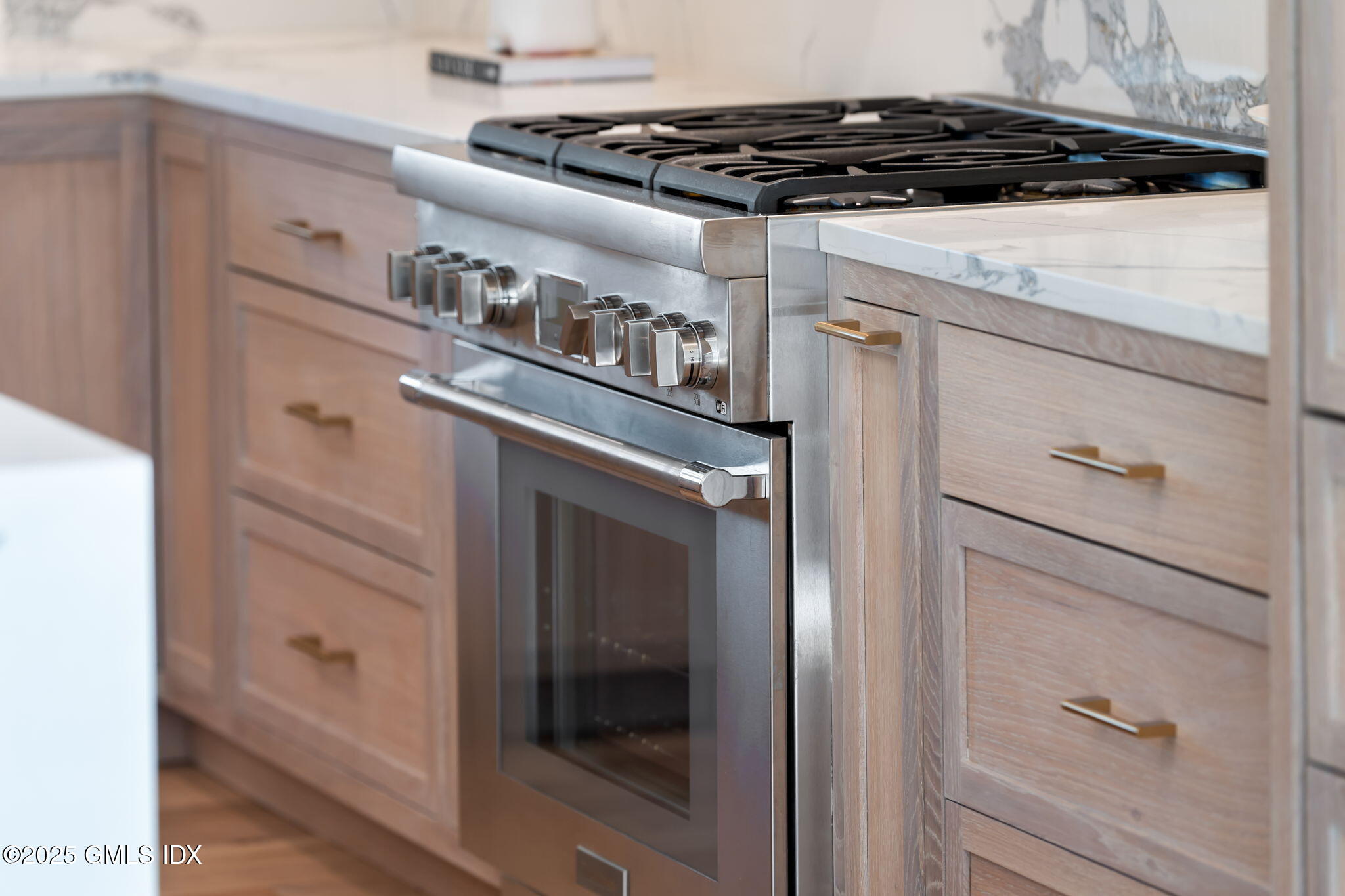 44 Amherst Road Old Greenwich, CT 06870 - Photo 17 of 39 a close view of a stove and a refrigerator
