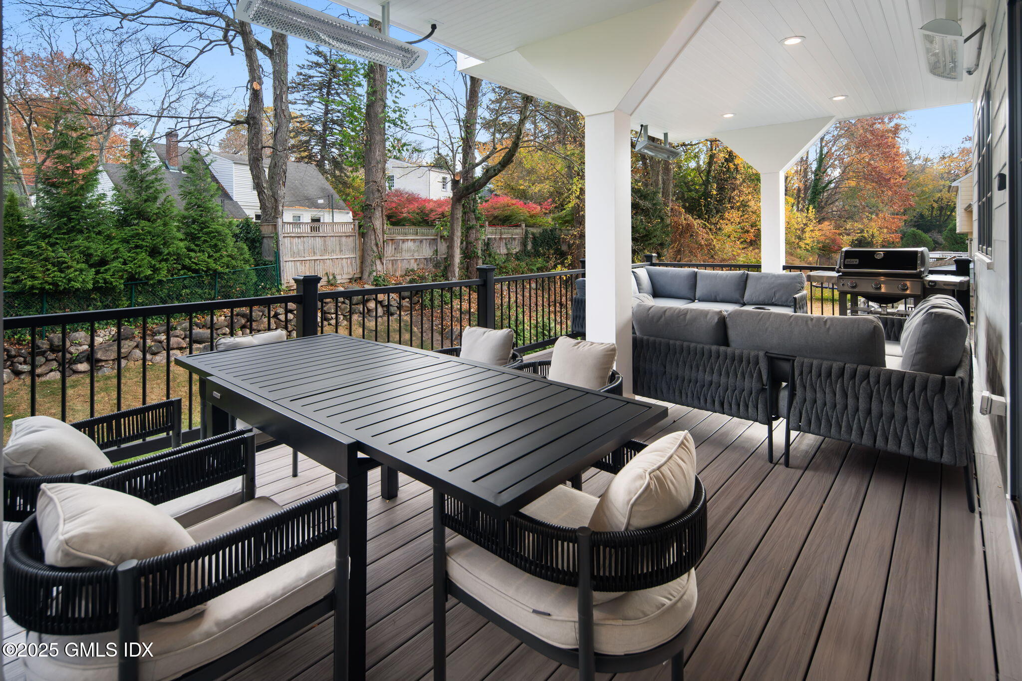 44 Amherst Road Old Greenwich, CT 06870 - Photo 21 of 39 an outdoor sitting area with furniture and wooden floor