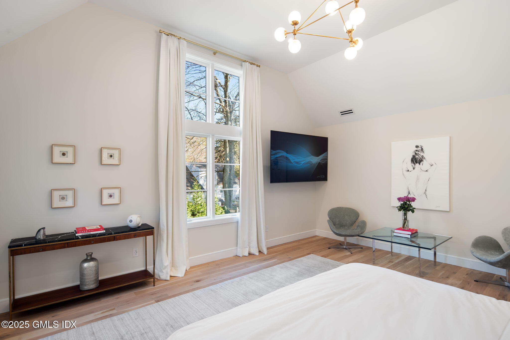 44 Amherst Road Old Greenwich, CT 06870 - Photo 25 of 39 a bedroom with furniture and a flat screen tv