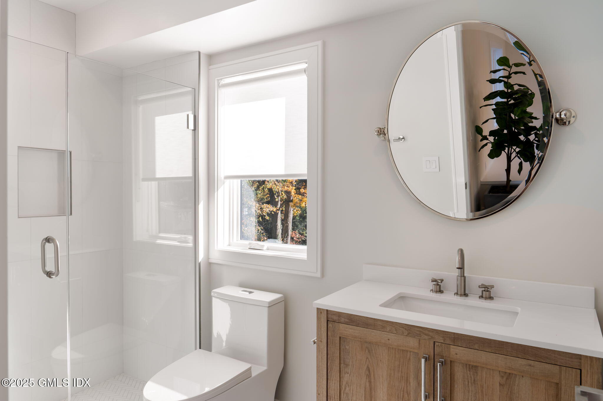 44 Amherst Road Old Greenwich, CT 06870 - Photo 32 of 39 a bathroom with a toilet sink vanity and mirror