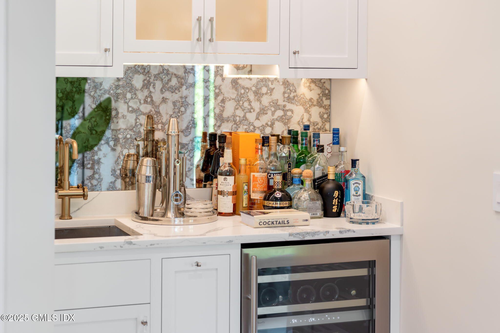 44 Amherst Road Old Greenwich, CT 06870 - Photo 10 of 39 a kitchen with a sink and a mirror