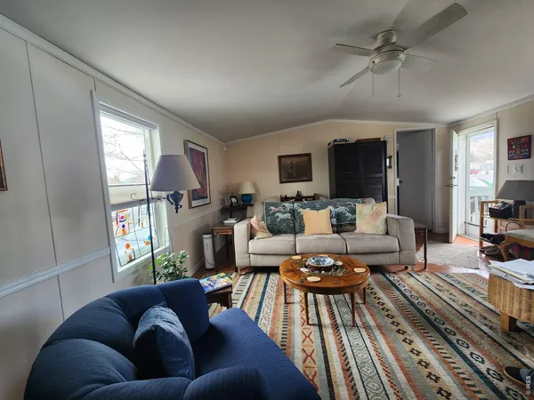 a living room with furniture fireplace and a flat screen tv