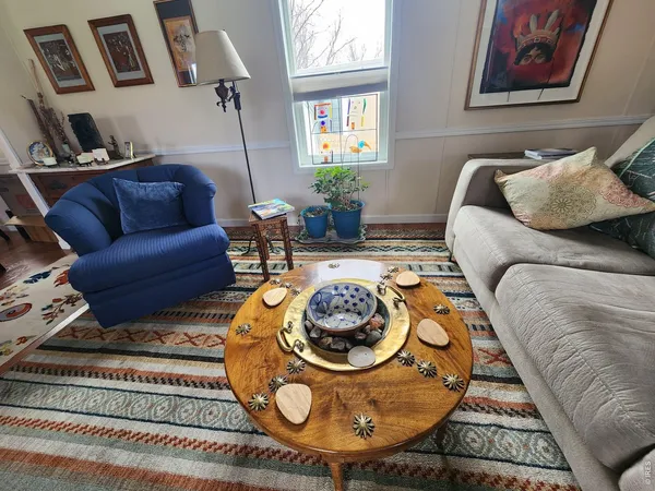 a living room with furniture and a rug