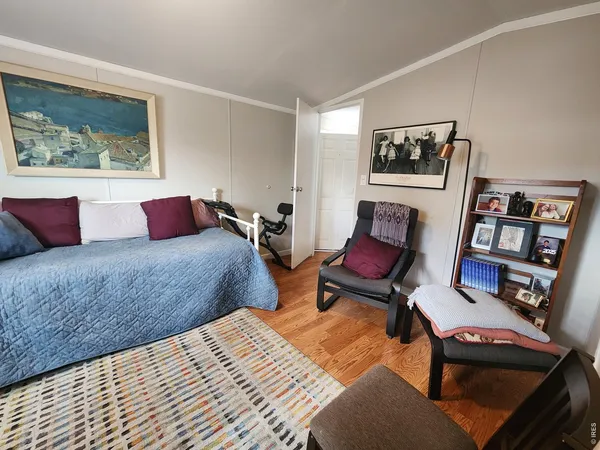 a bedroom with a bed and furniture