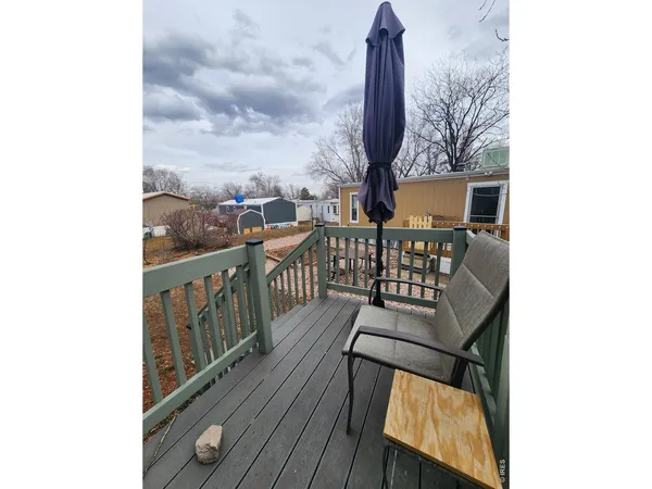 a view of a balcony with furniture