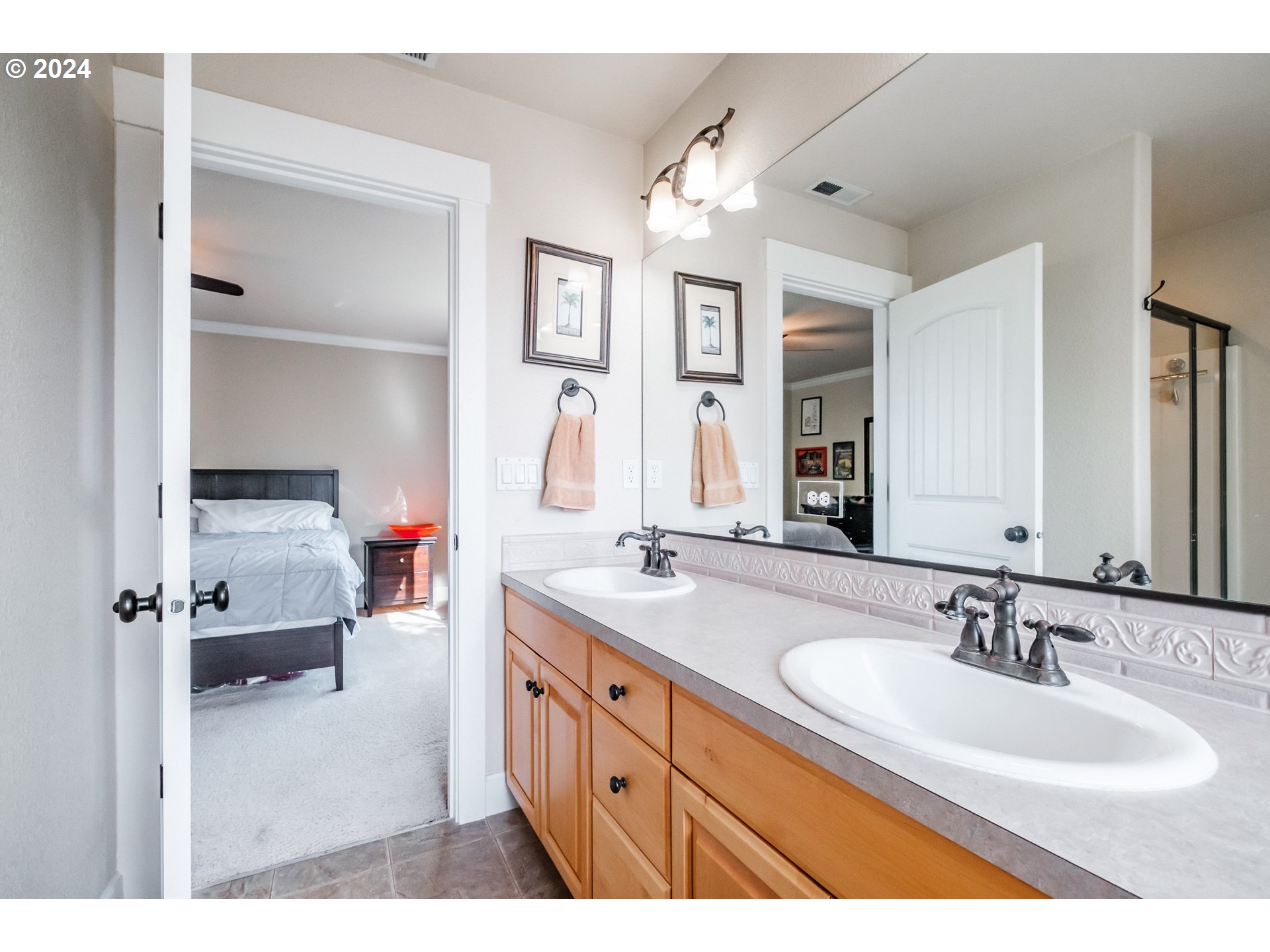 323 Northwest Reed Lane Dallas, OR 97338 - Photo 30 of 40 a bathroom with a sink double vanity and a mirror