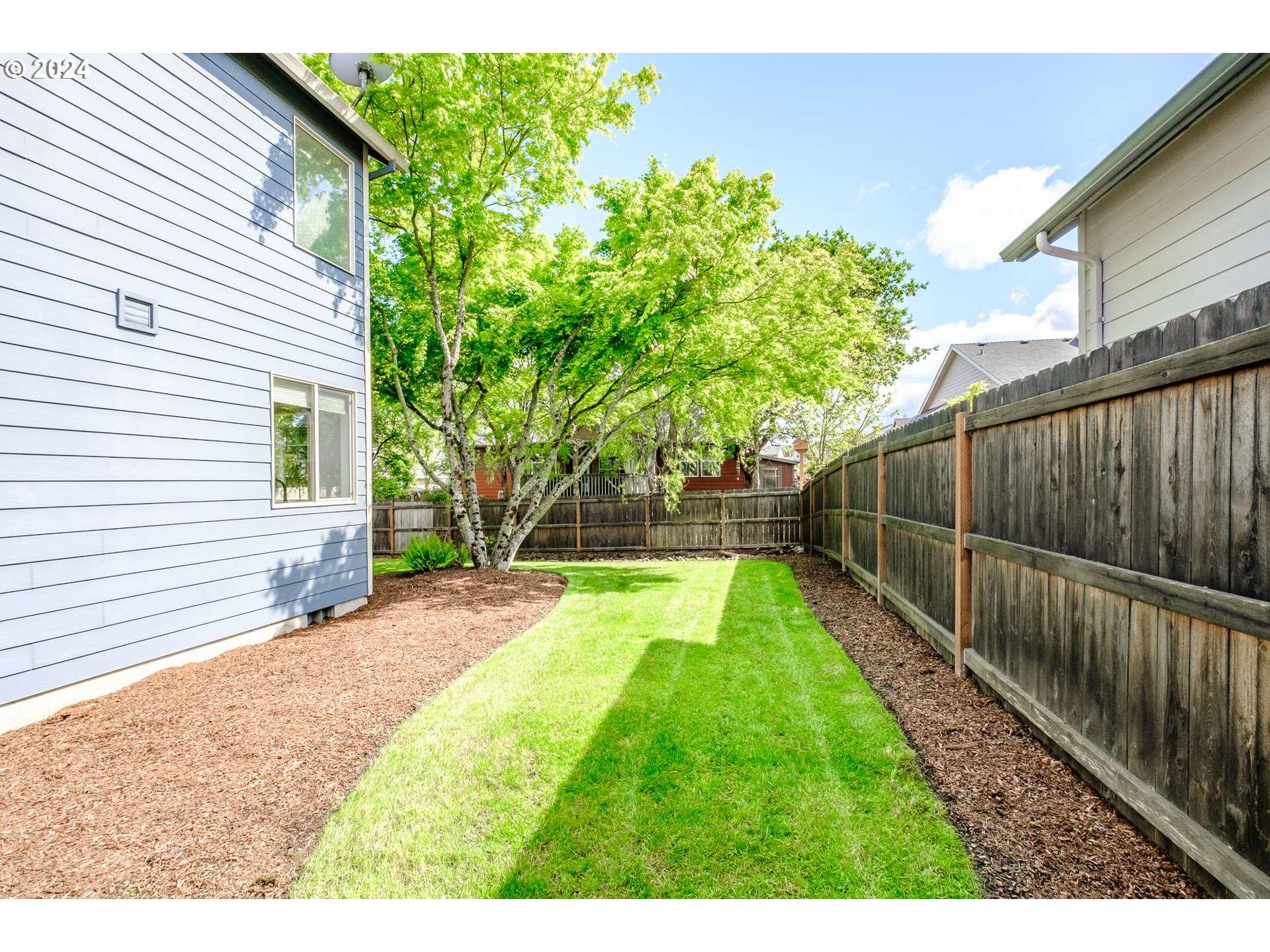 323 Northwest Reed Lane Dallas, OR 97338 - Photo 39 of 40 a view of a backyard with wooden fence