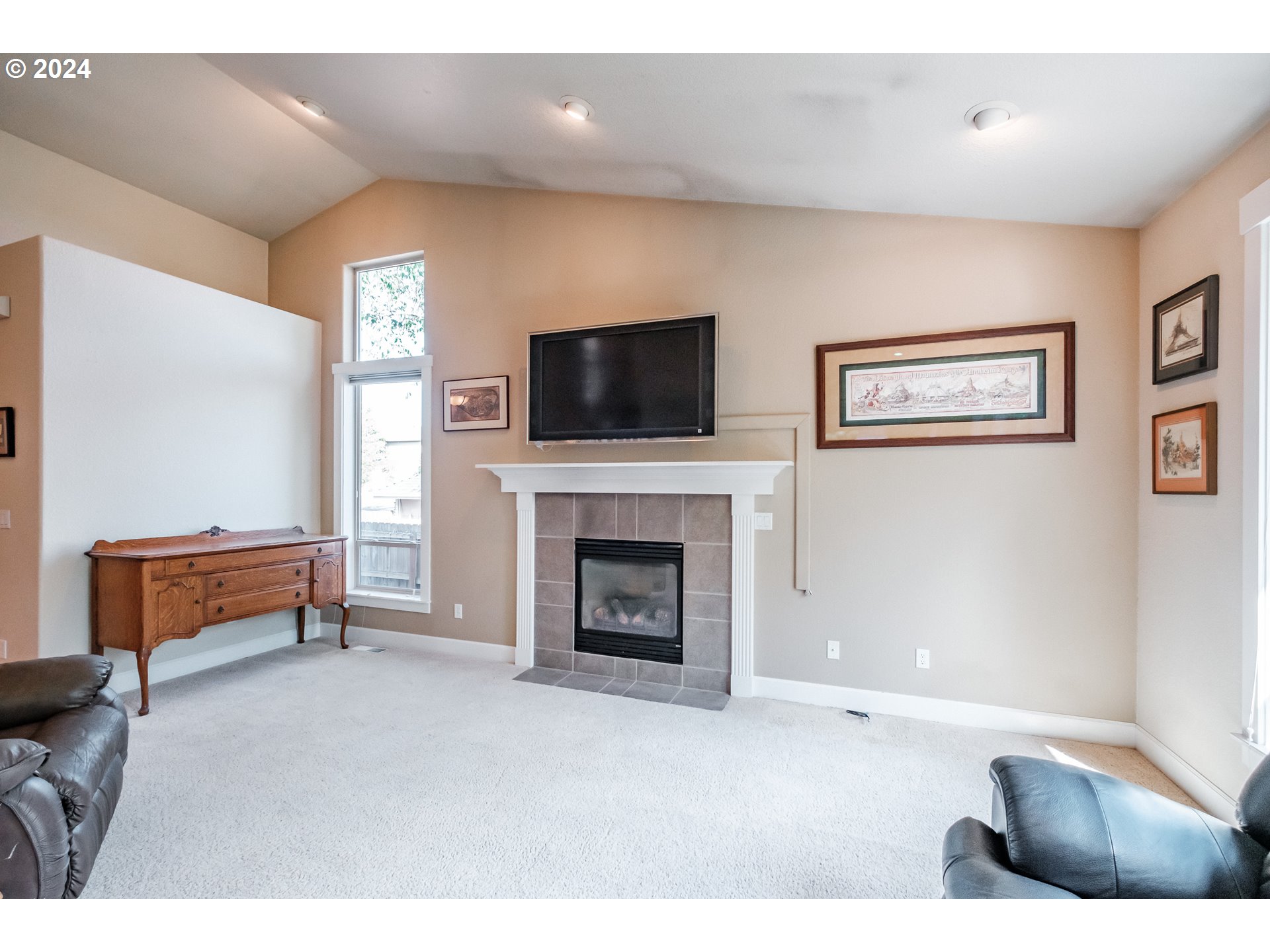 323 Northwest Reed Lane Dallas, OR 97338 - Photo 7 of 40 a living room with furniture and a fireplace