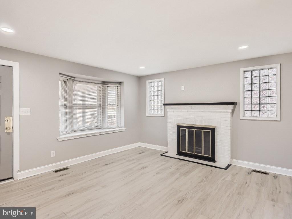 1913 Crestview Road Baltimore, MD 21239 - Photo 6 of 26 Living Room with Fireplace