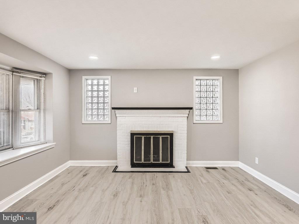 1913 Crestview Road Baltimore, MD 21239 - Photo 7 of 26 Living Room with Fireplace