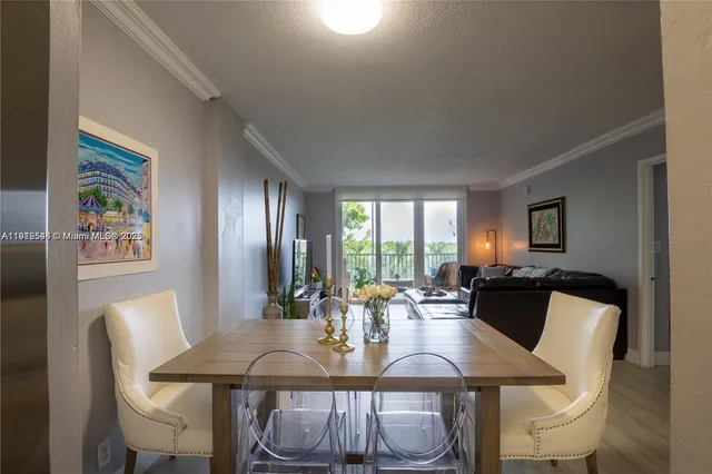 a view of a dining room with furniture and window