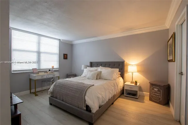 a bedroom with a bed and a table in it