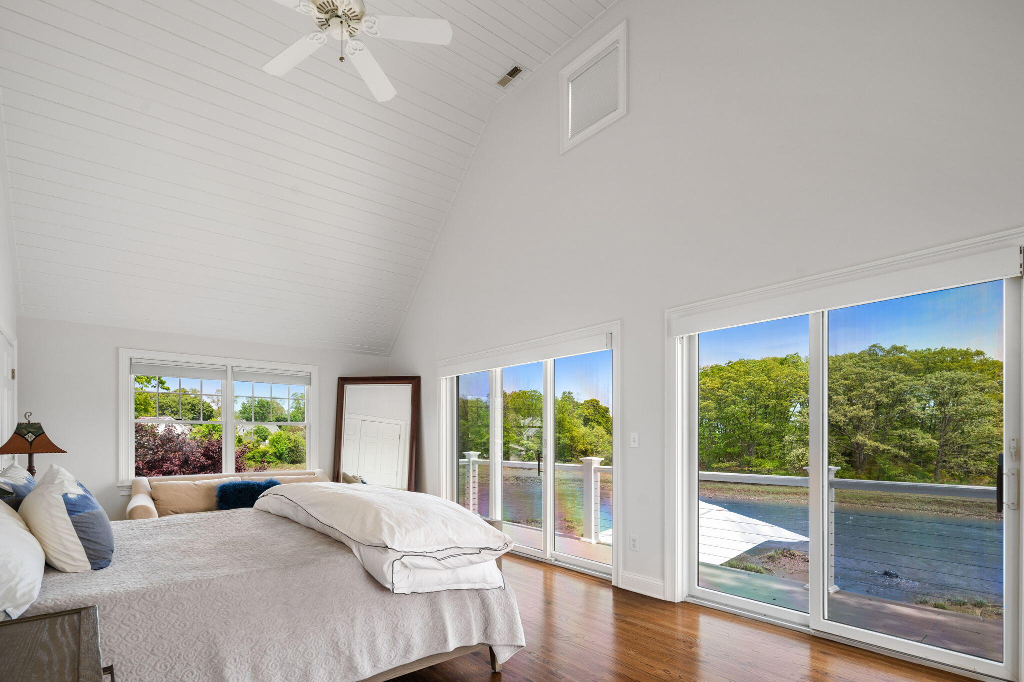 69 Roton Avenue Rowayton, CT 06853 - Photo 21 of 31 a bedroom with a bed and a large window with the outer view