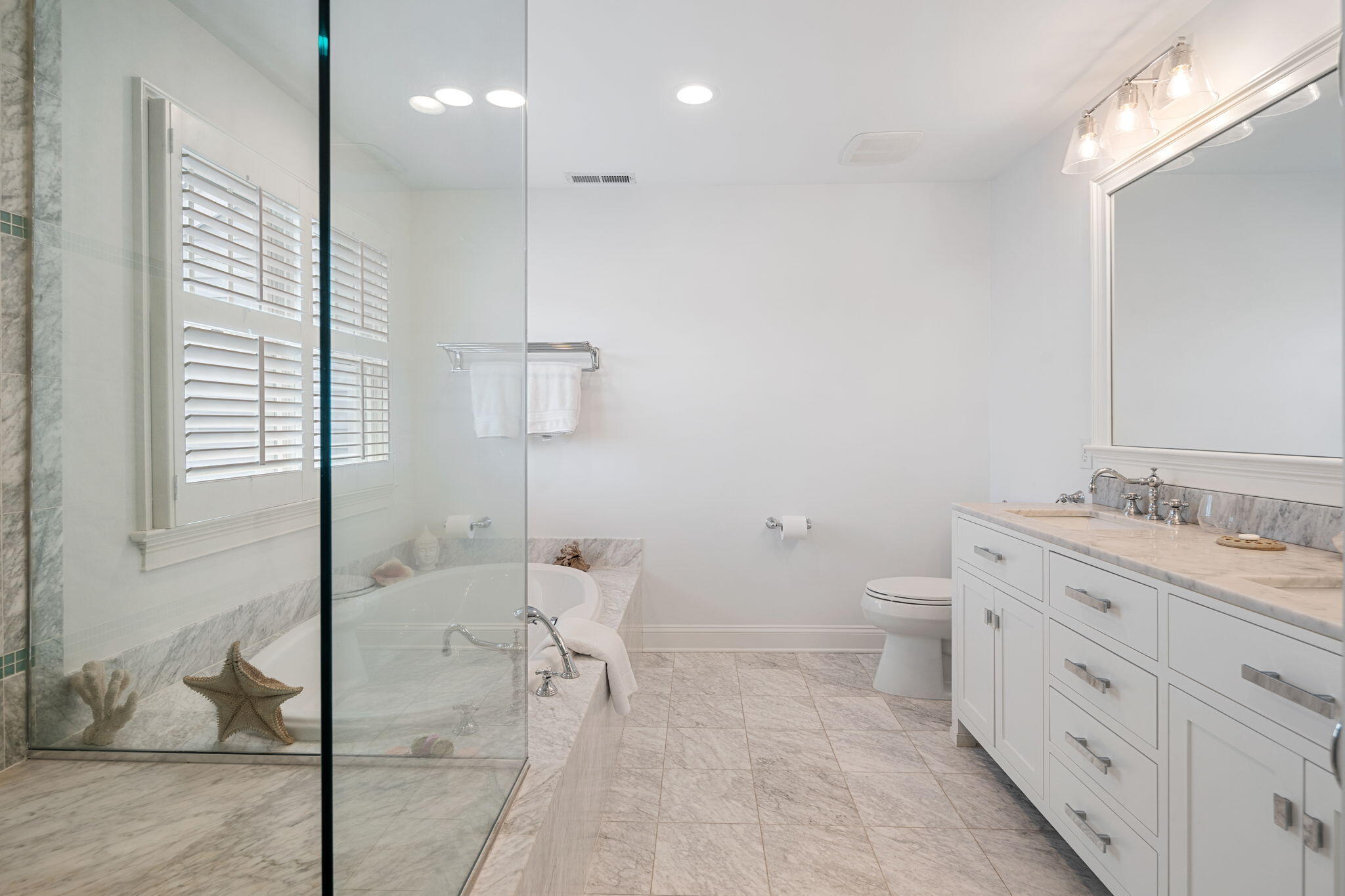 69 Roton Avenue Rowayton, CT 06853 - Photo 23 of 31 a bathroom with a granite countertop sink mirror vanity and toilet