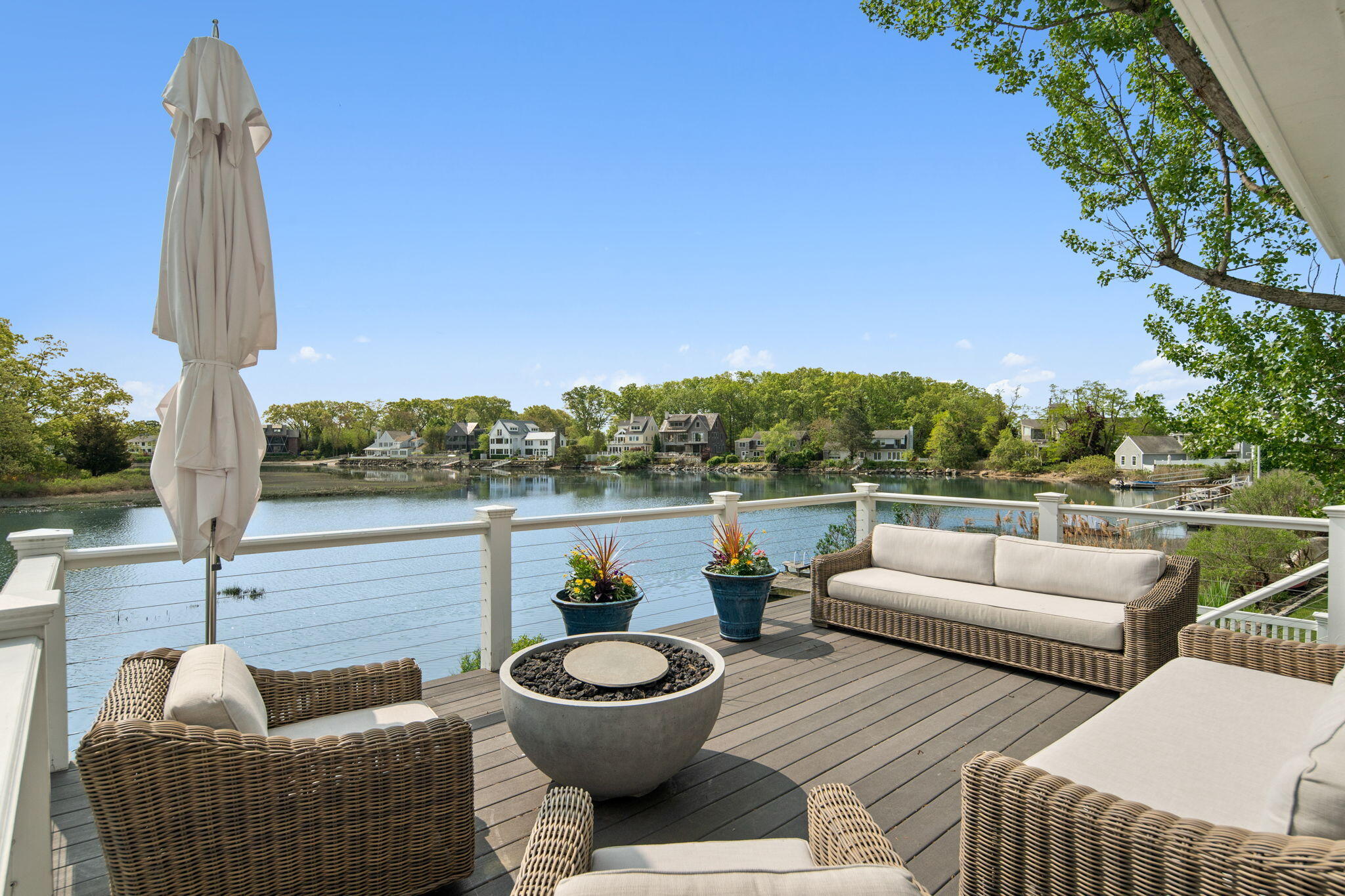 69 Roton Avenue Rowayton, CT 06853 - Photo 3 of 31 a balcony with outdoor seating and plants