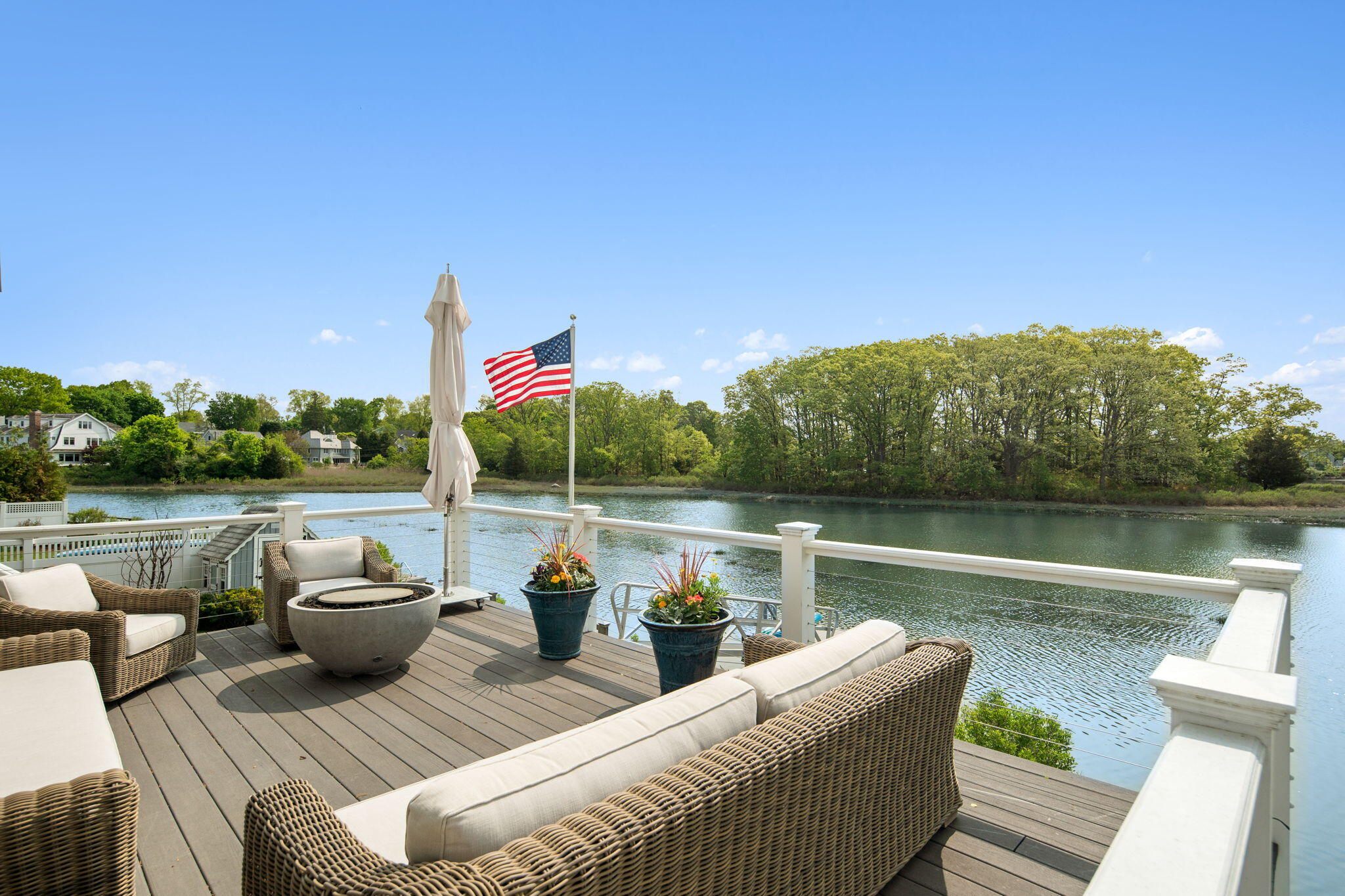 69 Roton Avenue Rowayton, CT 06853 - Photo 4 of 31 a lake view with a couch and chairs