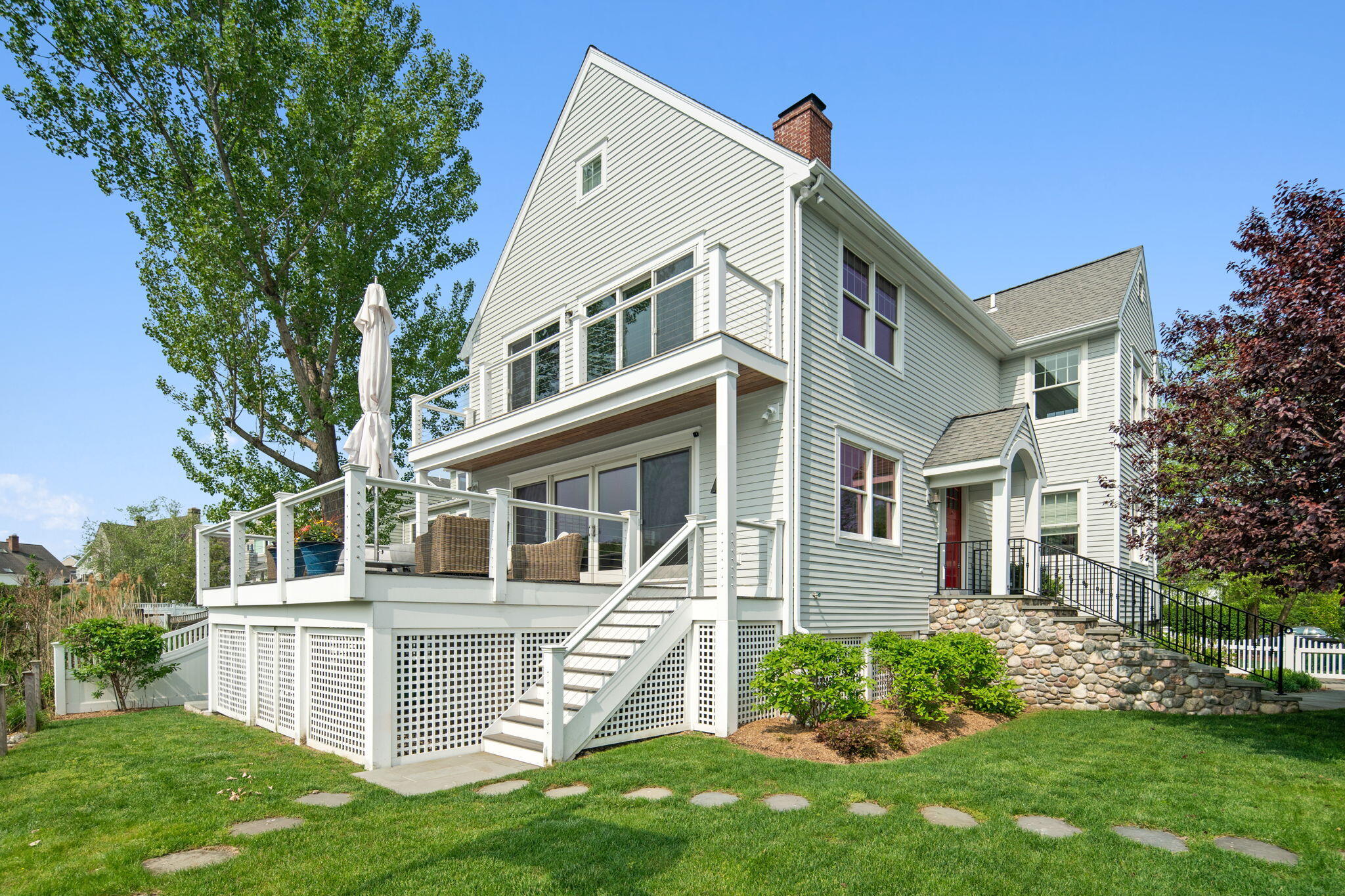 69 Roton Avenue Rowayton, CT 06853 - Photo 8 of 31 a view of a house with a yard