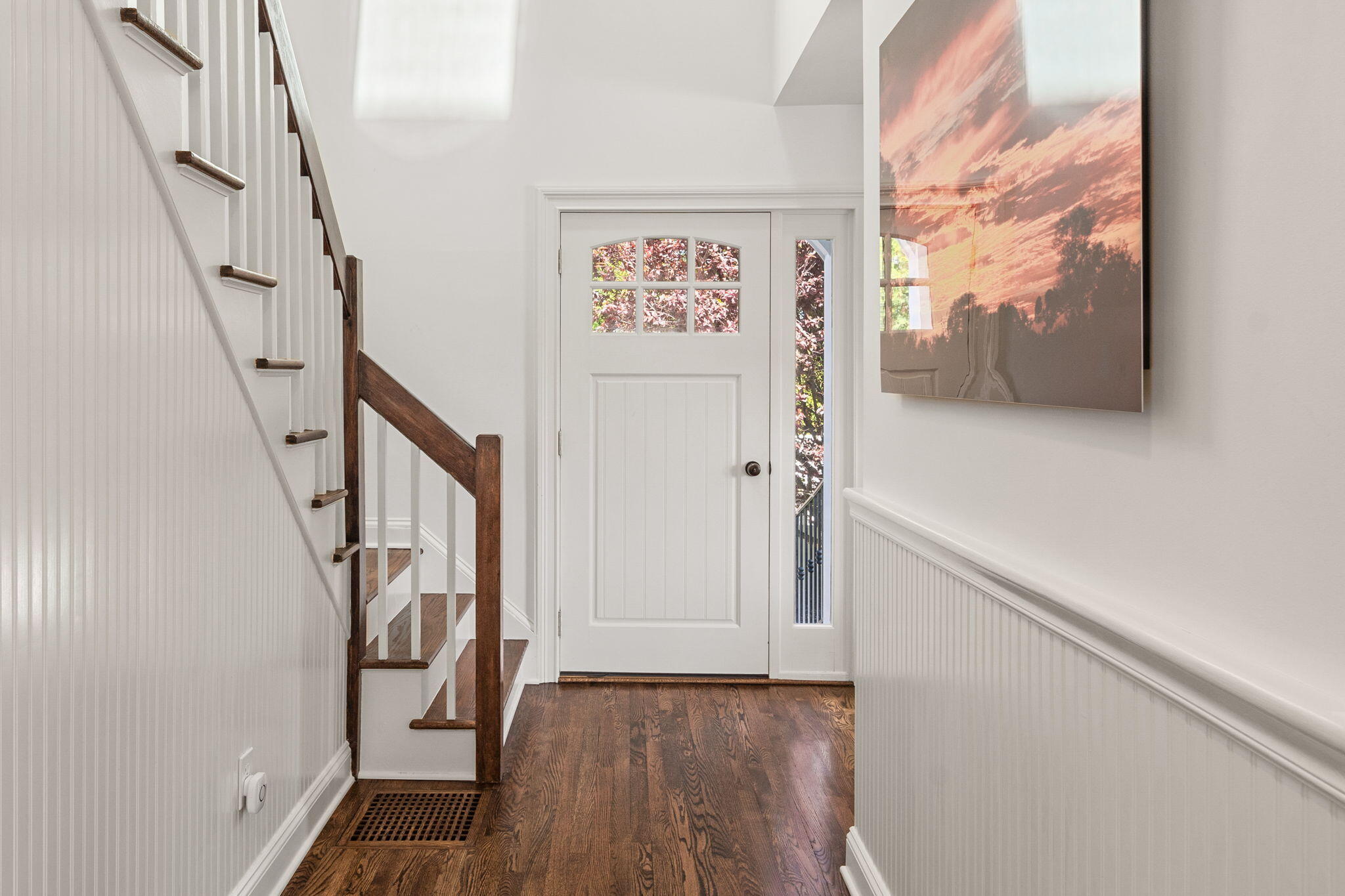 69 Roton Avenue Rowayton, CT 06853 - Photo 10 of 31 a view of a hallway with wooden floor and staircase