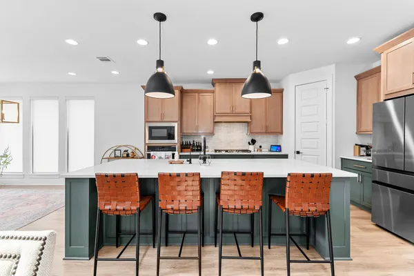 a large kitchen with granite countertop lots of counter top space