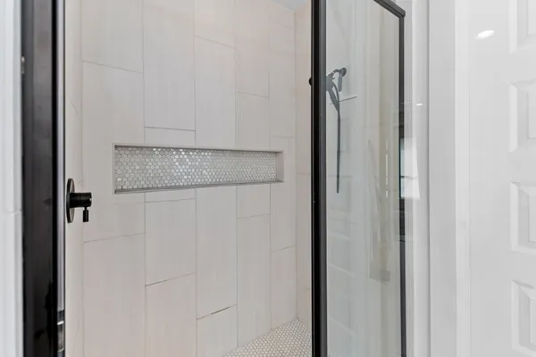 a bathroom with a sink double vanity and a mirror