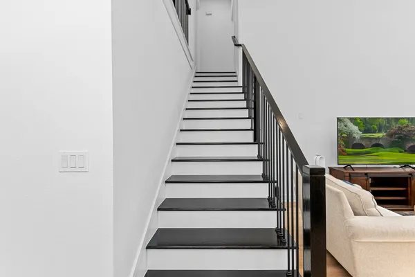 a bathroom with a granite countertop shower and a sink