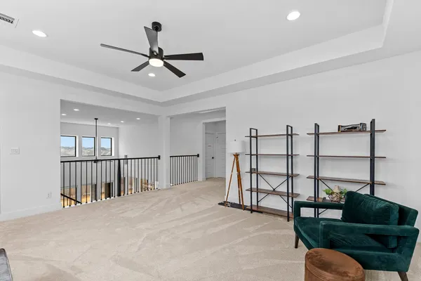 a view of a living room and wooden floor