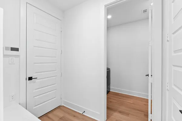 a view of walk in closet with empty racks