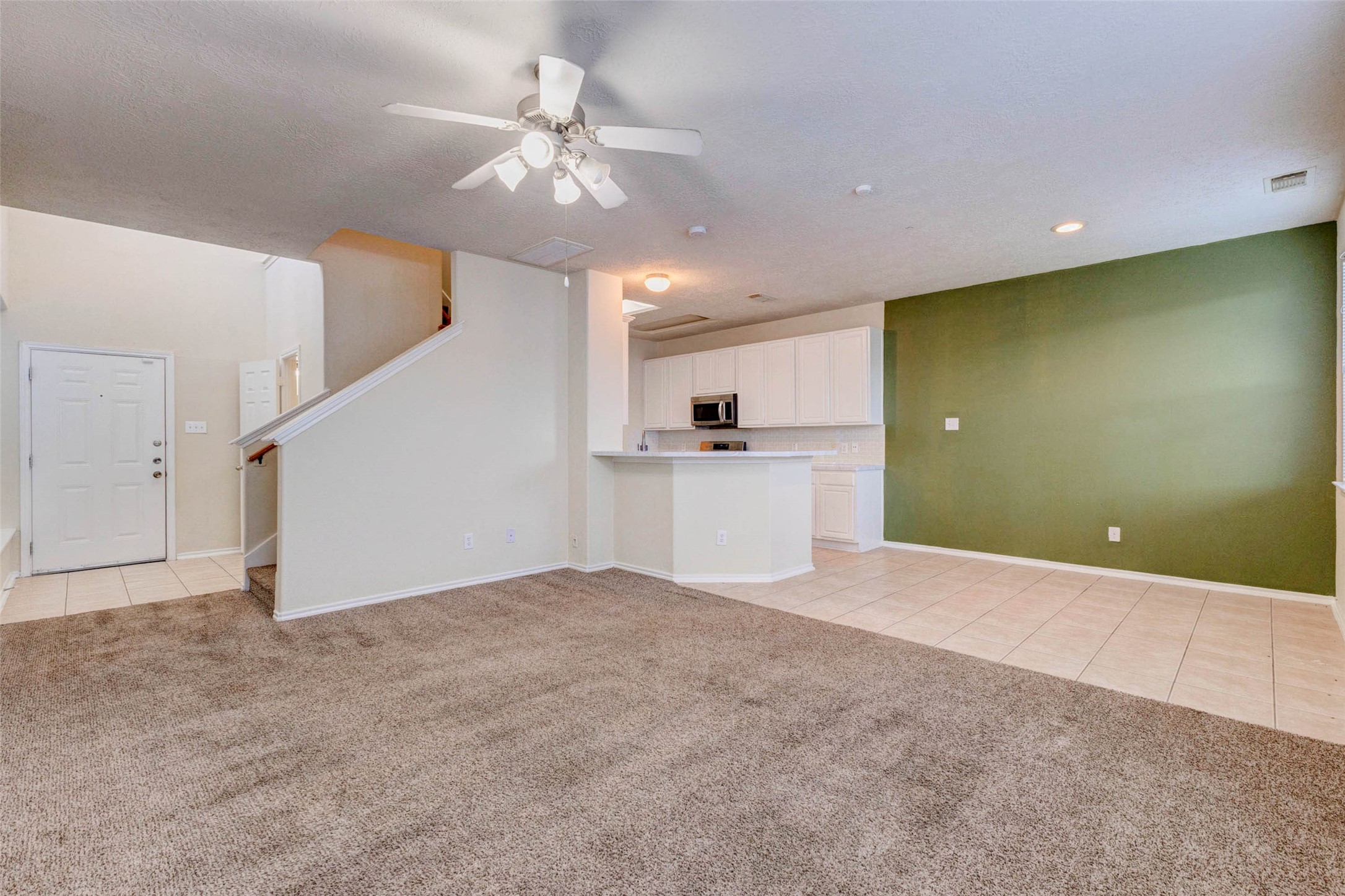 13106 Peppergate Lane Houston, TX 77044 - Photo 4 of 17 a view of a livingroom with a kitchen
