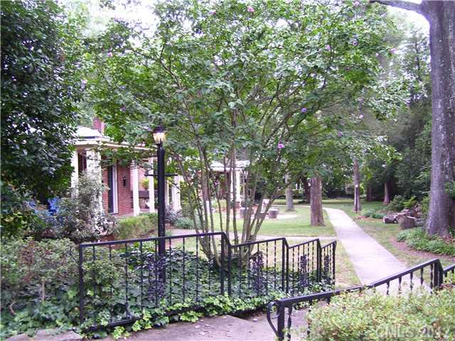 2408 Providence Road, Unit 1 Charlotte, NC 28211 - Photo 1 of 7 a view of a backyard with plants and patio