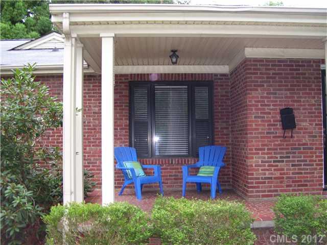 2408 Providence Road, Unit 1 Charlotte, NC 28211 - Photo 2 of 7 a backyard of a house with outdoor seating