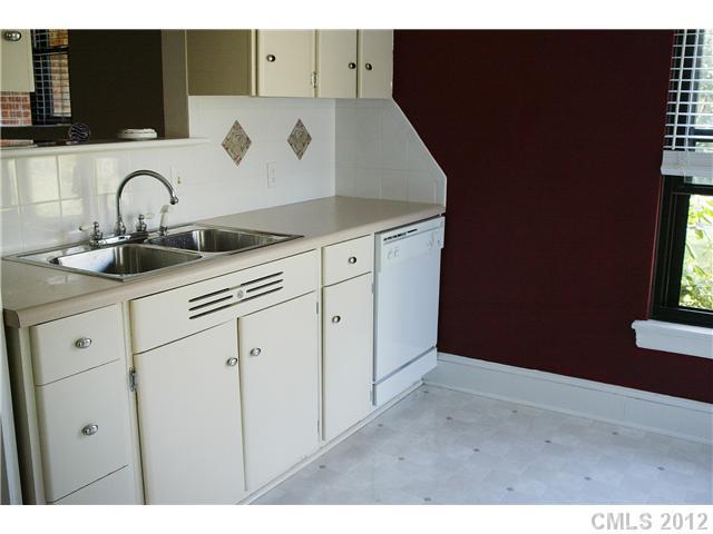 2408 Providence Road, Unit 1 Charlotte, NC 28211 - Photo 5 of 7 a kitchen with a sink and cabinets
