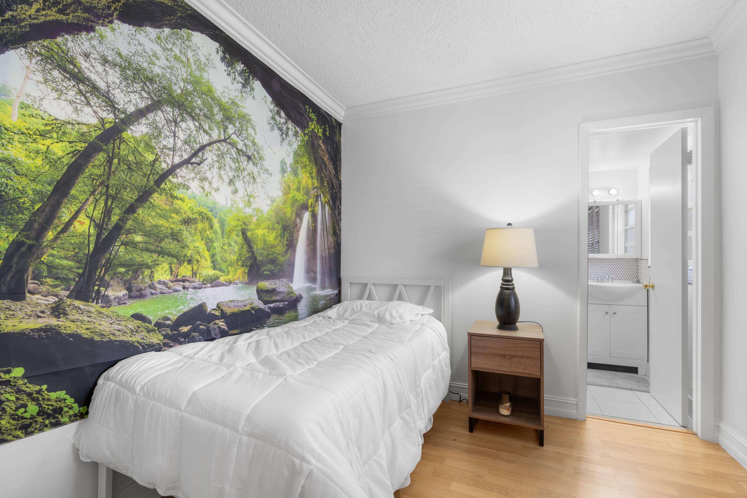 5501 Northwest 2nd Avenue, Unit 213 Boca Raton, FL 33487 - Photo 12 of 17 a spacious bedroom with a bed and a window