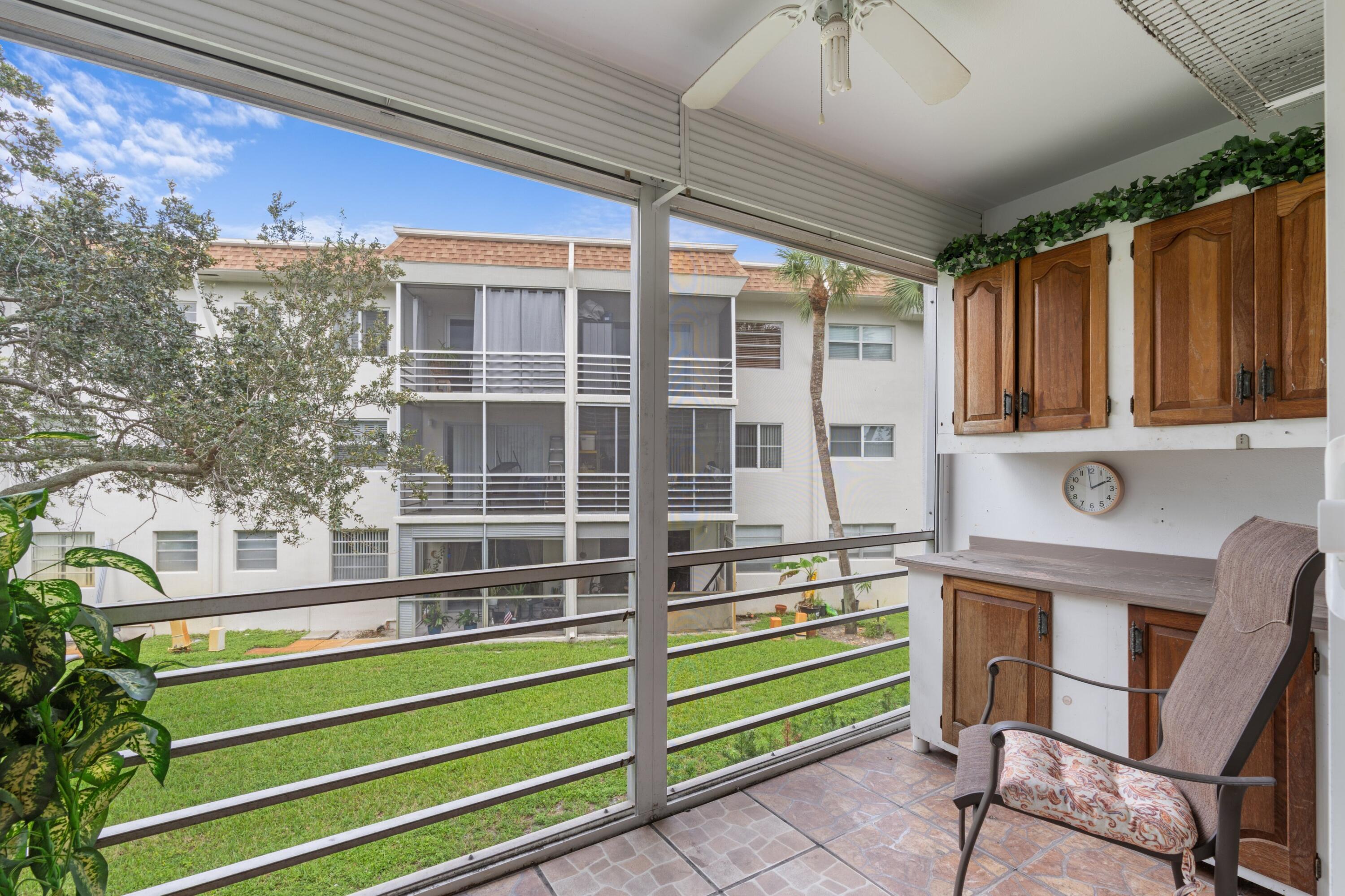 5501 Northwest 2nd Avenue, Unit 213 Boca Raton, FL 33487 - Photo 15 of 17 a view of front door and porch