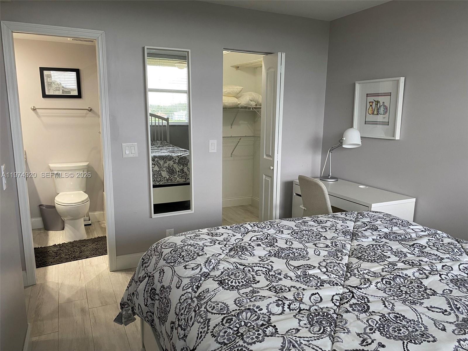 2929 South Ocean Boulevard, Unit 5090 Boca Raton, FL 33432 - Photo 17 of 25 a bedroom with a large bed and a window