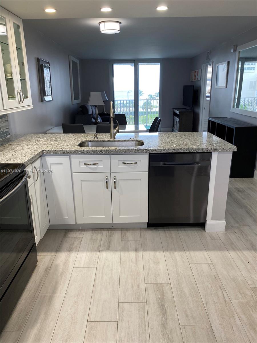 2929 South Ocean Boulevard, Unit 5090 Boca Raton, FL 33432 - Photo 4 of 25 a kitchen with a sink cabinets and window